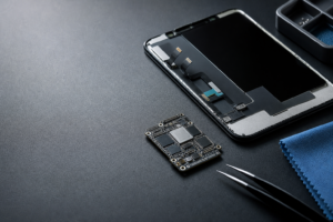 Smartphone display assembly and logic board symbolizing AI-era phone repair